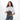 Woman holding a Sherpani Co-Pilot Granite Travel Toiletry Case against white backdrop. #color_granite-grey