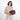 Woman holding a Sherpani Co-Pilot Smoky Orchid Travel Toiletry Case against white backdrop. #color_smoky-orchid-pink