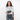Woman holding a Sherpani Mini Co-Pilot Granite Grey Mini Travel Organizer against white backdrop. #color_granite-grey