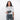 Woman holding a Sherpani Mini Co-Pilot Granite Mini Travel Organizer against white backdrop. #color_granite-grey