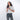 Woman holding a Sherpani Barcelona Carbon Black Anti-theft RFID Mini Wallet on white backdrop. #color_carbon-black