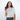 Woman holding a Sherpani Barcelona Carbon Black Anti-Theft Mini Wallet on white backdrop.  #color_carbon-black
