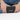 Woman holding a Sherpani Barcelona Chromatic Black RFID Mini Wallet on white backdrop. #color_chromatic-black