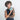 Woman holding a Sherpani Barcelona Surf Blue RFID Mini Wallet on white backdrop. #color_surf-blue
