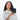 Woman holding a Sherpani Vienna Carbon Black Anti-theft Passport Wallet against white background. #color_carbon-black