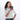 A woman holding a Sherpani Vienna Granite Grey Anti-theft Passport Wallet against a white background.  #color_granite-grey