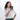 Woman holding a Sherpani Vienna Granite Anti-theft Passport Wallet against white background. #color_granite-grey