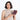 A woman holding a Sherpani Vienna Smoky Orchid Anti-theft Passport Wallet against a white background.  #color_smoky-orchid-pink