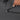 Person locking the zipper of a Sherpani Boston Granite Anti-theft Weekender.